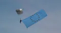 Parachutist wearing a big EU Europa flag HD Footage