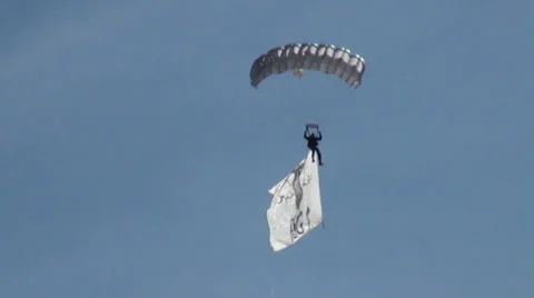 Parachutist wearing a big GSG 9 flag Stock Footage 38812722