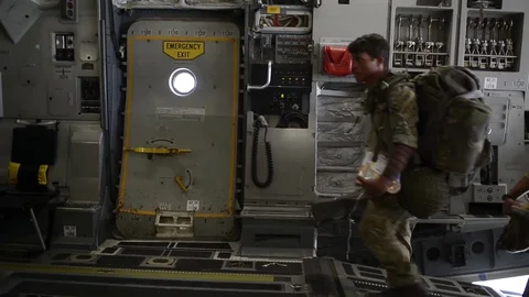 Parachutists board C-17 for exercise Swift Response Stock Footage 90936609