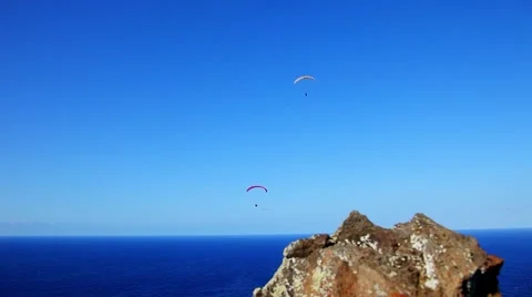 Parachutists fly over water Video stock 43857930