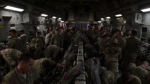 Parachutists preparing for static line jump from C-17 Stock Footage 90939283