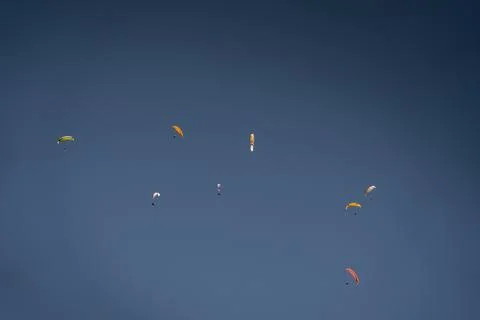 Parachutists soaring in the sky Stock Photos