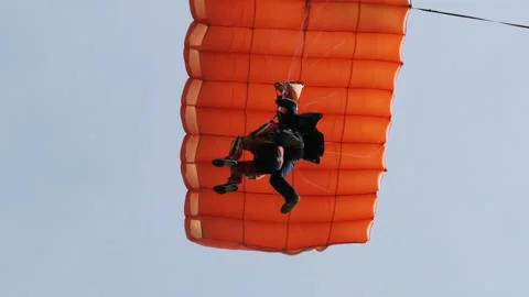 Parachutists in Tandem Flying in the Sky with a Parachute. Slow Motion Video stock 155541753