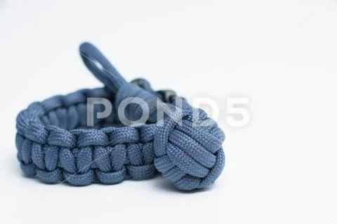 Paracord cobra knot bracelet wristlet with monkey fist Stock Photos