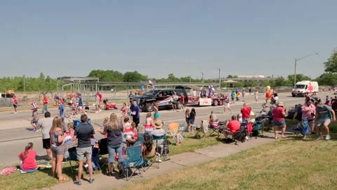Parade float and people passing out treats on 4th of July 4k Stock Footage 236177575