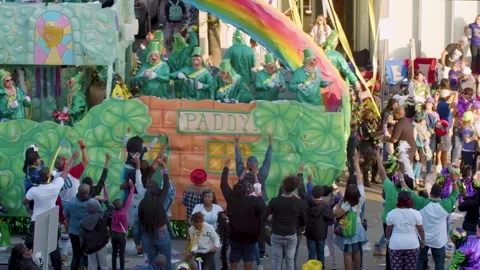 Parade Goers Reach for Throws from St. Patrick’s Day Float at Rex Mardi Gras Stock Footage 314432352