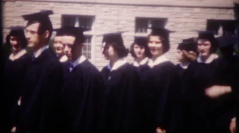 Parade of graduates on college campus 1950s vintage film home movie 2895 Stock Footage