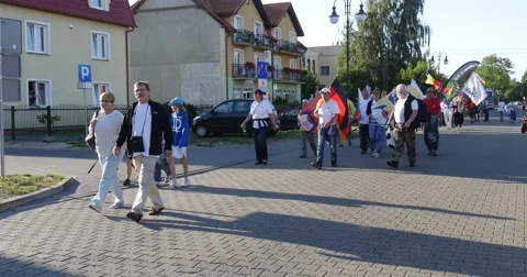 A Parade of People Flying The Flags of Different countries and beating drums Stock Footage 54207986