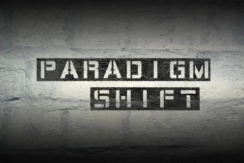 Paradigm shift gr paradigm shift stencil print on the grunge white brick w... Stock Photos