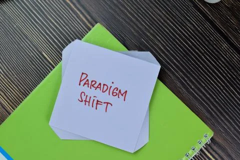 Paradigm Shift write on sticky notes isolated on Wooden Table. Stock Photos