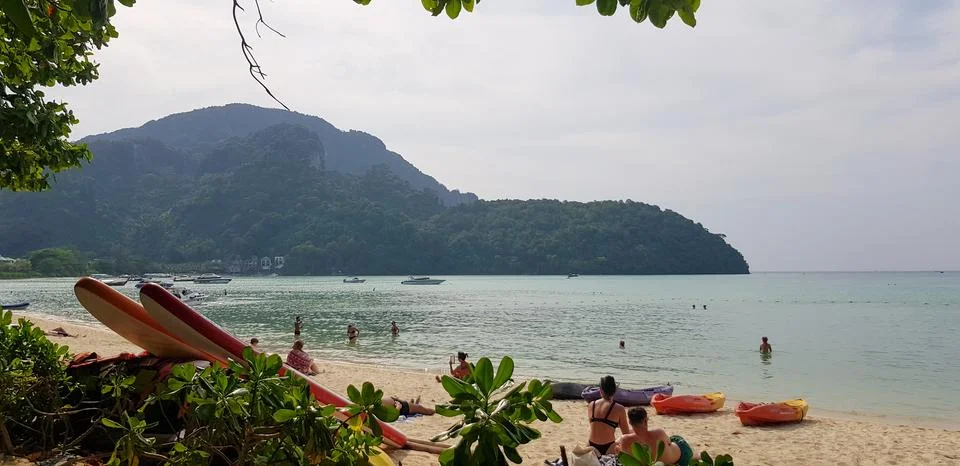 Paradisaical Views of Koh Phi Phi Island from the beach with surf boards Stock Photos