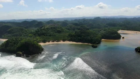 Paradise beach on pristine Asmara coast, East Java, Indonesia. Aerial Stock Footage 164507664
