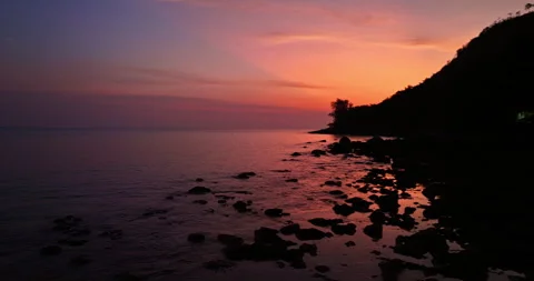 Paradise Coastline with Sun Rays and Ocean Reflection from Above Stock-Footage 335090269