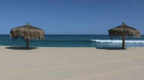 Paradise sand beach with parasol Stock Footage