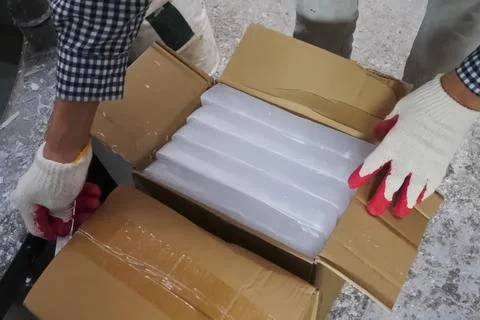 Paraffin bars in box, opening a box of paraffin. Stock Photos