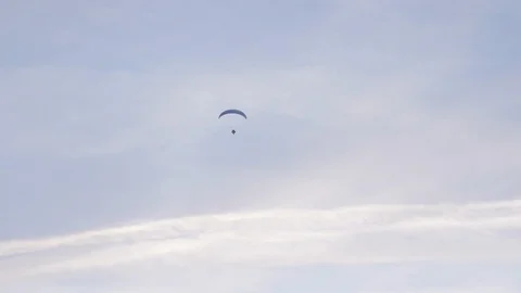 Paraglide with three paragliders on it during the sunset on french Stock Footage 104411314