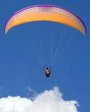 Paraglider above the cloud Stock Photos