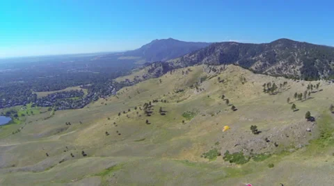 Paraglider aerial side tracking view in mountain foothills Video stock 32818754