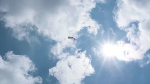 Paraglider against the blue sky and sun 스톡 동영상 313763532