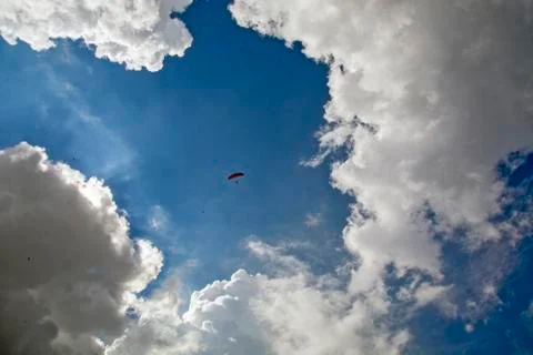 Paraglider among the clouds Stock Photos