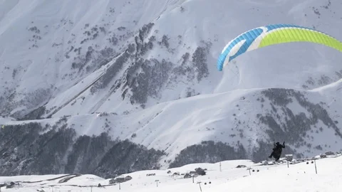 Paraglider on the background of snowy mountains. Stock Footage 108323384