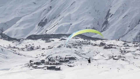 Paraglider on the background of snowy mountains. Stock Footage 108323486
