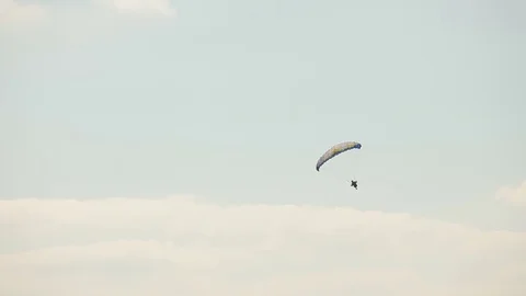 Paraglider in the blue sky Stock Footage 72772614