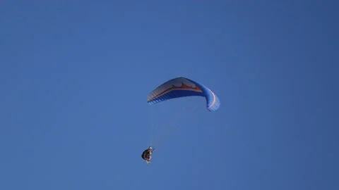 Paraglider in the blue sky Stock Footage 162274055