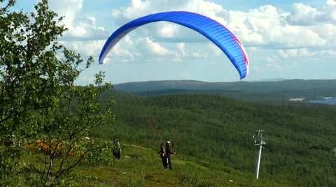 Paraglider caught the wind on a hillside. Stock Footage 68725578