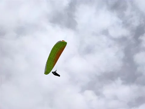 Paraglider on cloudy sky background Stock Photos