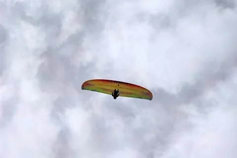 Paraglider on cloudy sky background Stock Photos