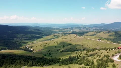 The paraglider descends from the top of the mountain using the strong wind 01 Stock Footage 171294044