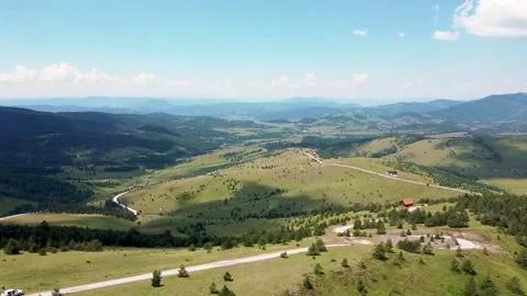 The paraglider descends from the top of the mountain using the strong wind 06 Stock Footage 171294528