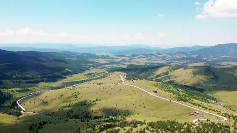The paraglider descends from the top of the mountain using the strong wind 07 Stock Footage 171294577