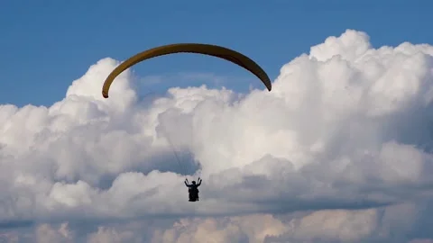 Paraglider Flies Down Over A Beautiful Mountain Landscape Stock Footage 171904168