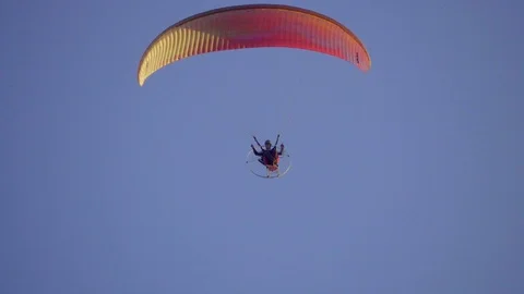 Paraglider flies on the motor paraplan Stock Footage 75917213