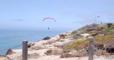 Paraglider in Flight over Ocean, La Jolla, California Stock Footage 136478360