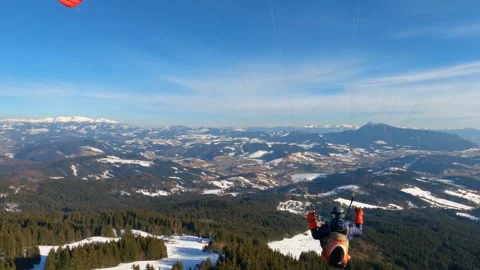 Paraglider fly above winter forest nature, Paragliding adrenaline adventure Stock Footage 238519972