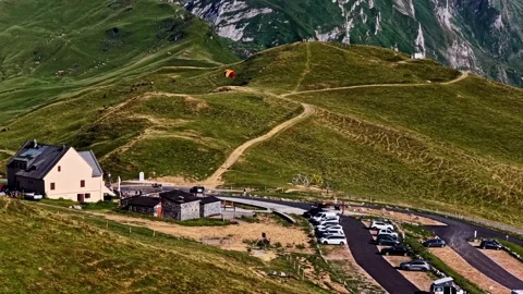 Paraglider flying above Col d'Aubisque in the French Pyrenees mountains on a Video stock 341537901
