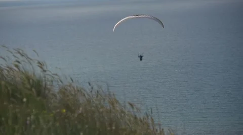 Paraglider flying in the bay Stock Footage 64620004