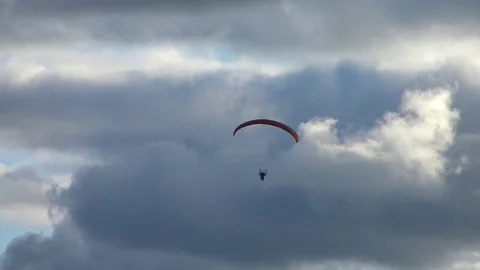 Paraglider flying high in the storm clouds. Stock Footage 81982475