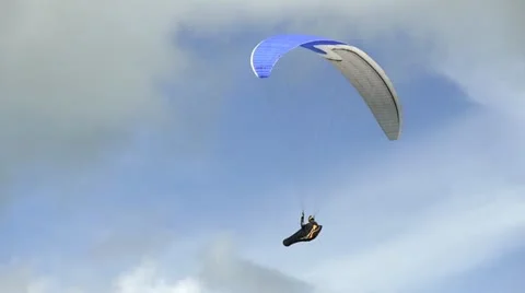 A paraglider flying hovering in the air Video stock 11872704