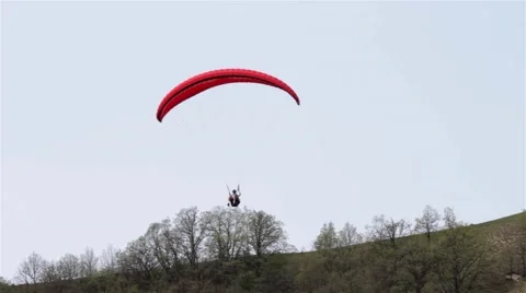 Paraglider flying at low height over some very steep bluffs  Stock Footage 59841968