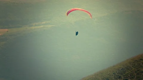 Paraglider flying over mountains Stock Footage 44115099