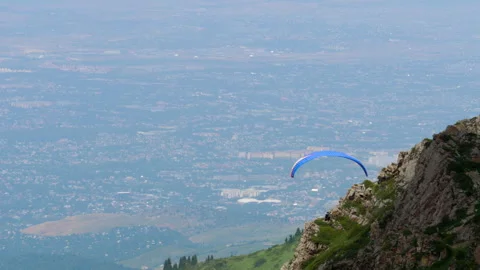 Paraglider flying over mountains Stock Footage 301393840