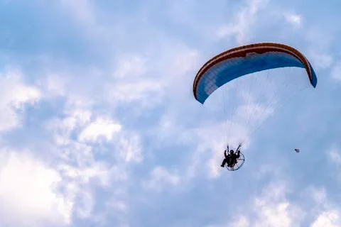 Paraglider flying with paramotor during sunset Foto stock
