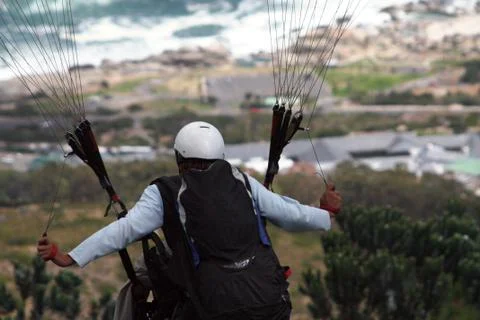 A paraglider flying Stock Photos