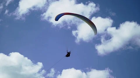 Paraglider flying in the sky Stock Footage