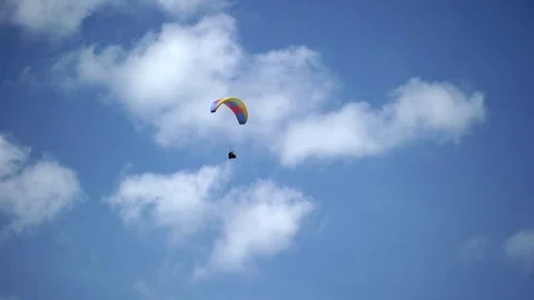 Paraglider flying in the sky Stock Footage