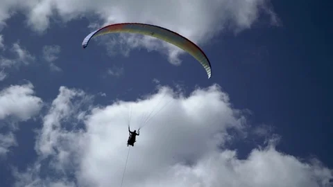 Paraglider flying in the sky Stock Footage